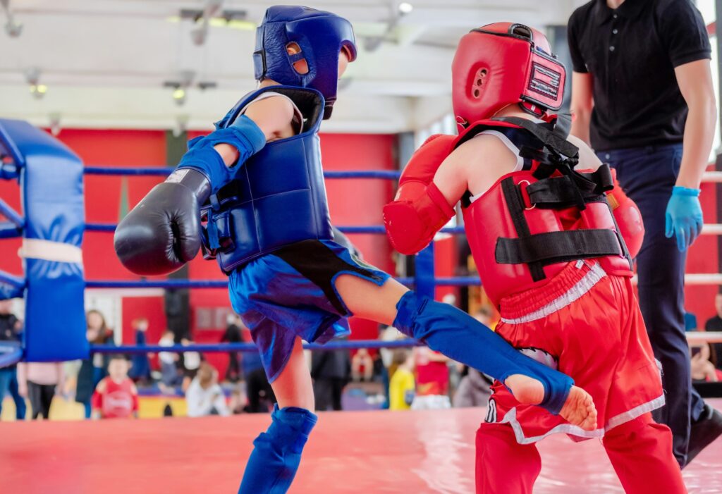 boxers in the ring. Boxer in full gear. Children's sports. Thai boxing. Boxing competition.