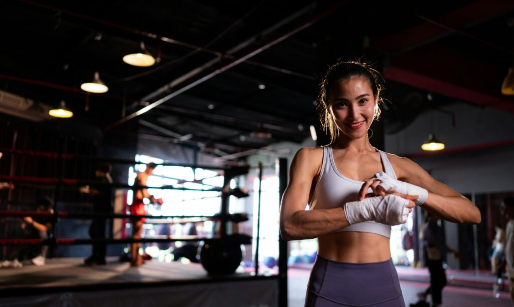 Portrait of woman learning Muay Thai to build up the strength of the body